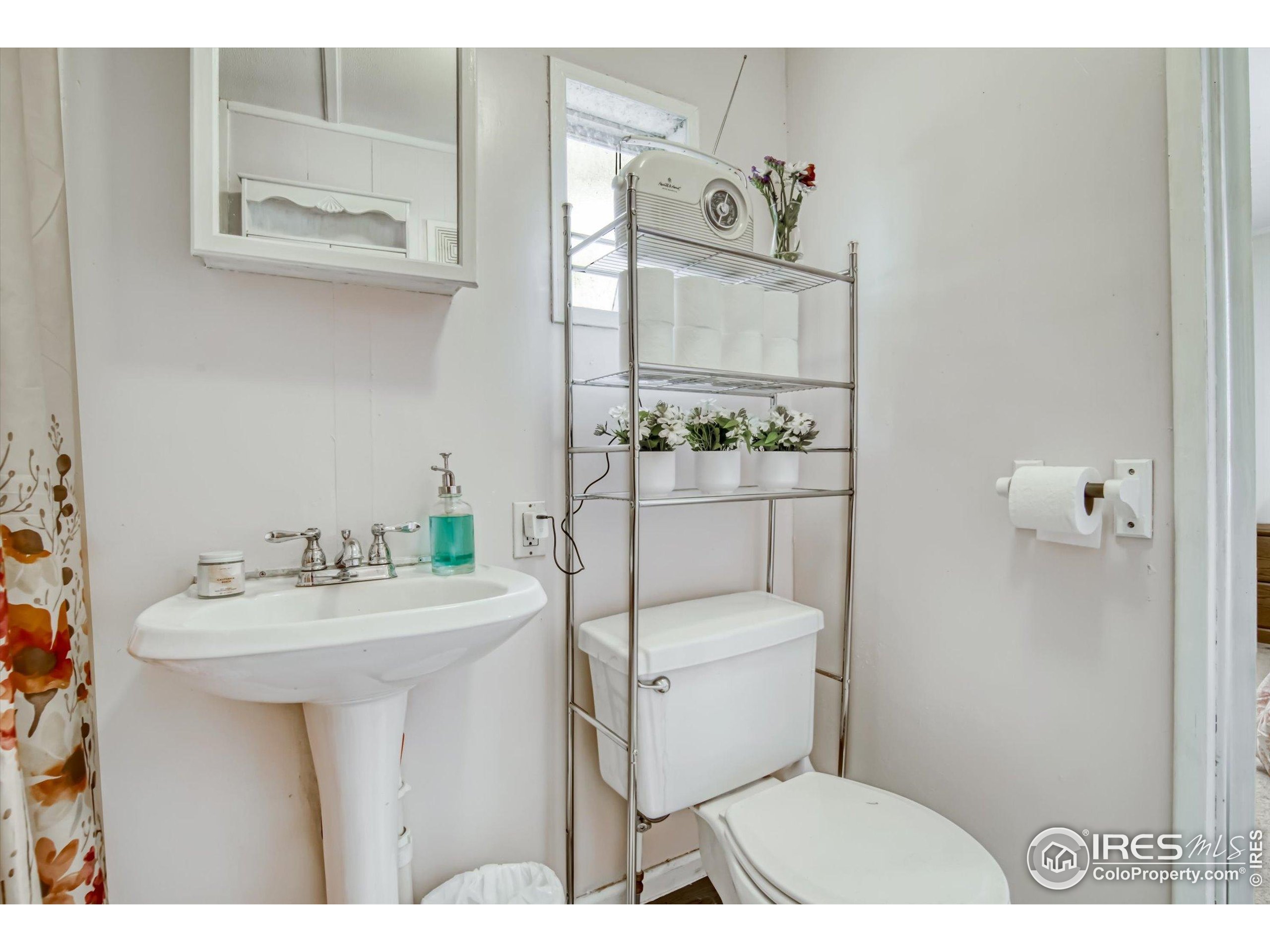 5000 Butte Street, Unit 272 Boulder, CO 80301 - Photo 15 of 21 a bathroom with a sink toilet and mirror