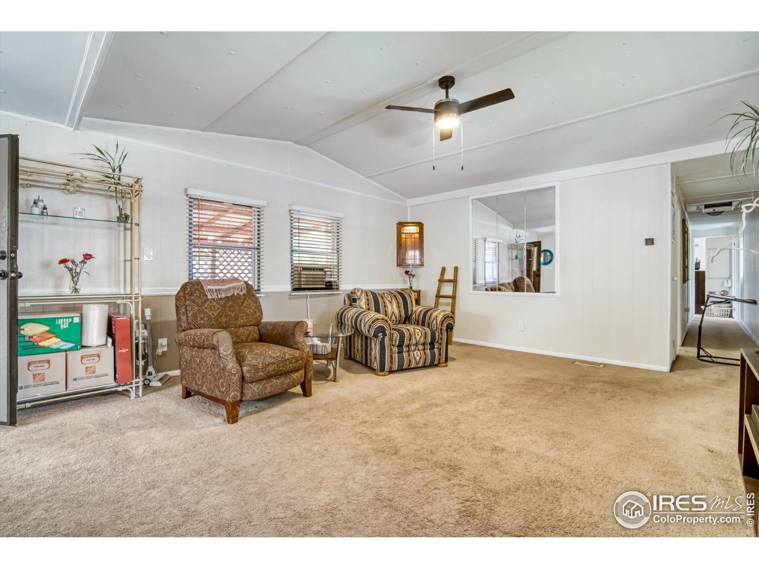 5000 Butte Street, Unit 272 Boulder, CO 80301 - Photo 7 of 21 a living room with furniture and ceiling fan