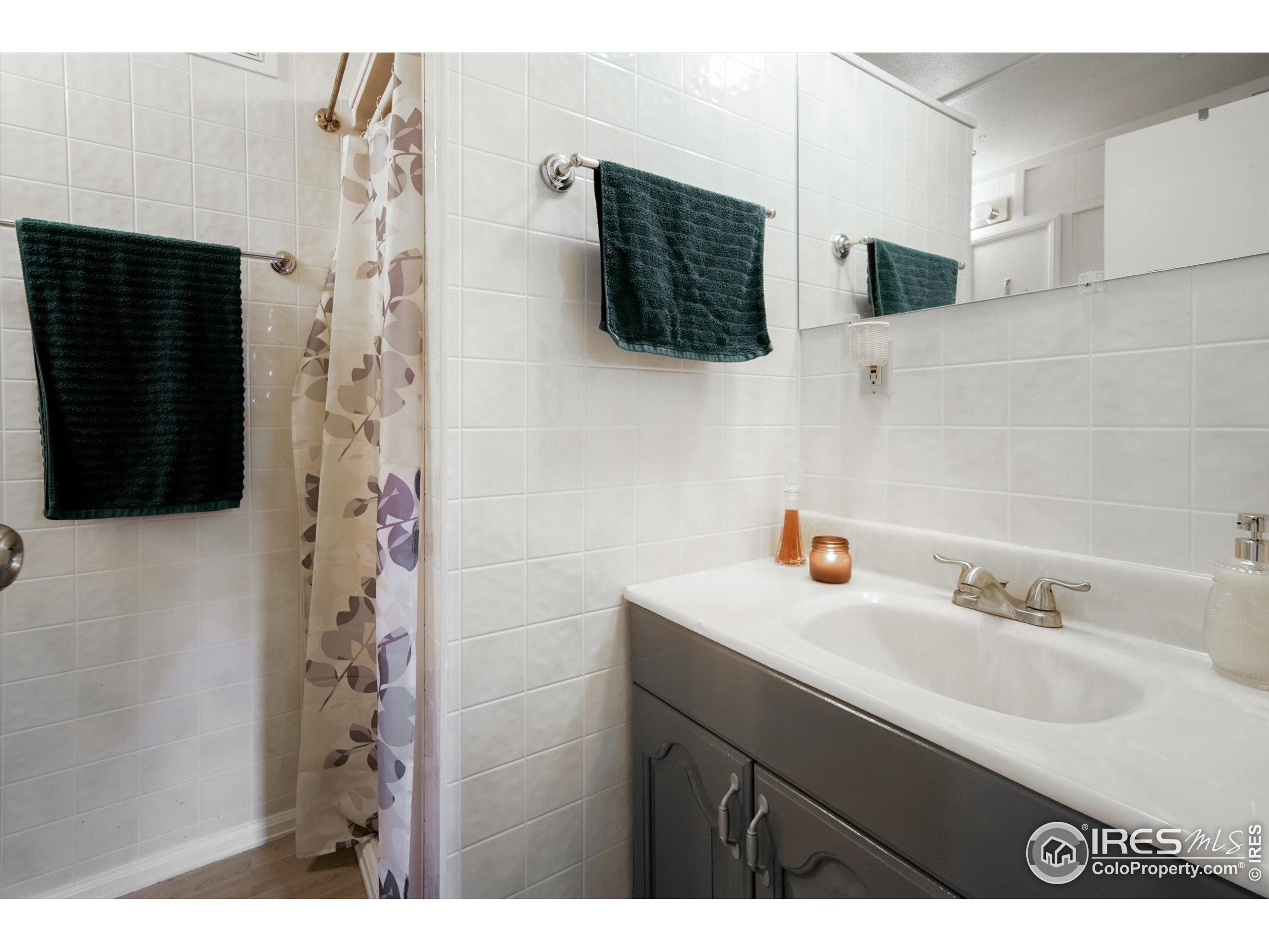 5000 Butte Street, Unit 272 Boulder, CO 80301 - Photo 10 of 21 a bathroom with a sink and a mirror