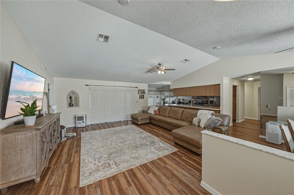 7435 Kilbride Court Weeki Wachee, FL 34613 - Photo 9 of 67 a living room with furniture and a flat screen tv