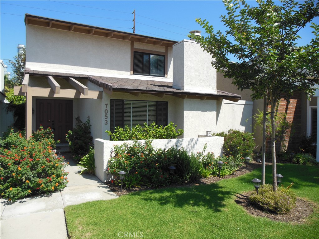 7053 Seawind Drive Long Beach, CA 90803 - Photo 1 of 47 a front view of a house with garden