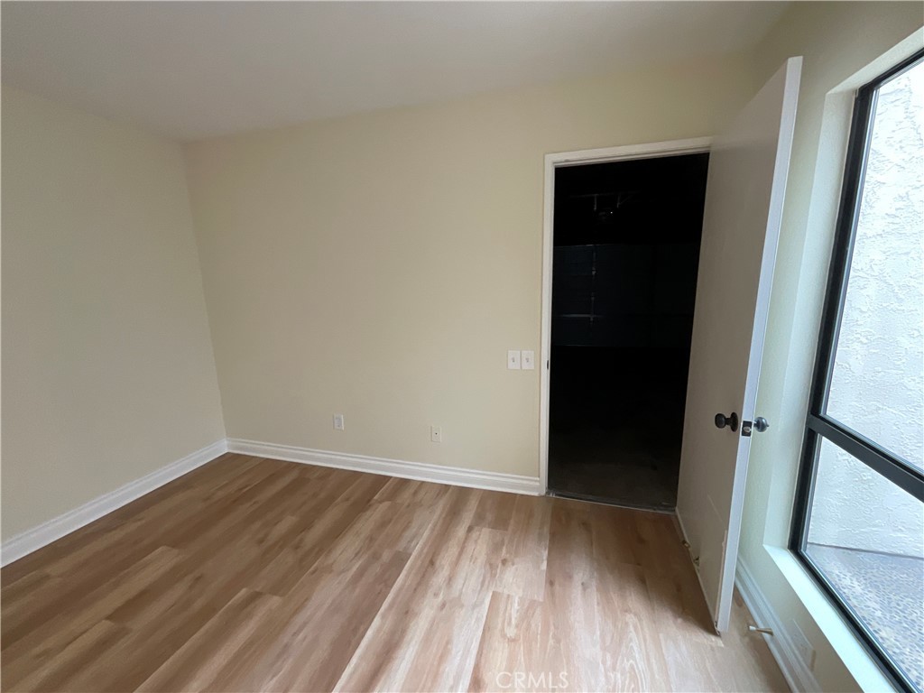 7053 Seawind Drive Long Beach, CA 90803 - Photo 19 of 47 wooden floor in an empty room