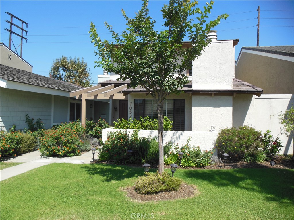 7053 Seawind Drive Long Beach, CA 90803 - Photo 2 of 47 a front view of house with a garden