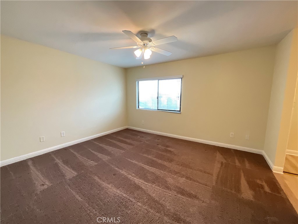 7053 Seawind Drive Long Beach, CA 90803 - Photo 24 of 47 an empty room with a window and a fan