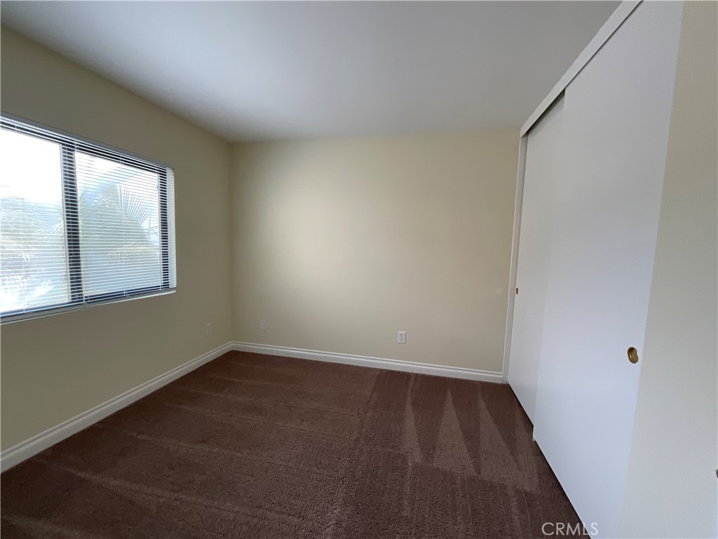 7053 Seawind Drive Long Beach, CA 90803 - Photo 35 of 47 wooden floor in an empty room with a window