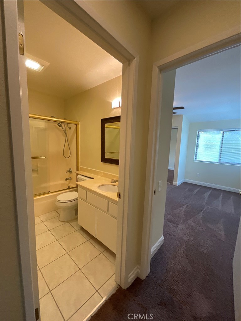 7053 Seawind Drive Long Beach, CA 90803 - Photo 37 of 47 a bathroom with a granite countertop sink mirror and toilet