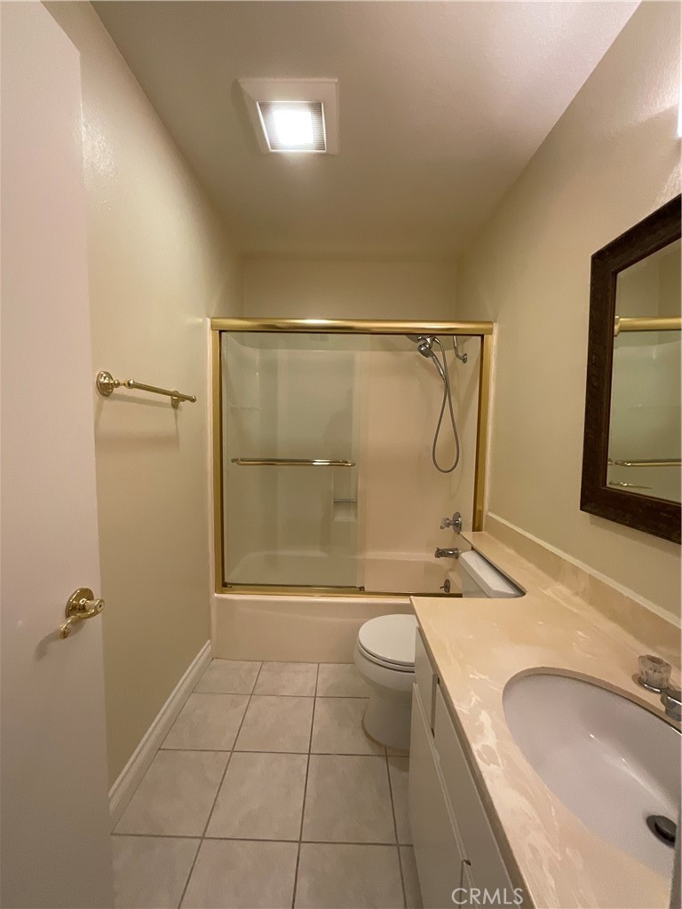 7053 Seawind Drive Long Beach, CA 90803 - Photo 38 of 47 a bathroom with a granite countertop sink toilet mirror vanity and shower