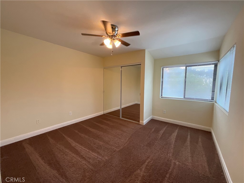 7053 Seawind Drive Long Beach, CA 90803 - Photo 39 of 47 a view of an empty room with wooden floor and a window