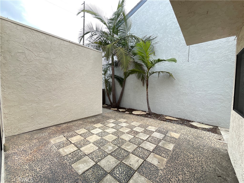7053 Seawind Drive Long Beach, CA 90803 - Photo 41 of 47 a vase of flowers sitting on a table