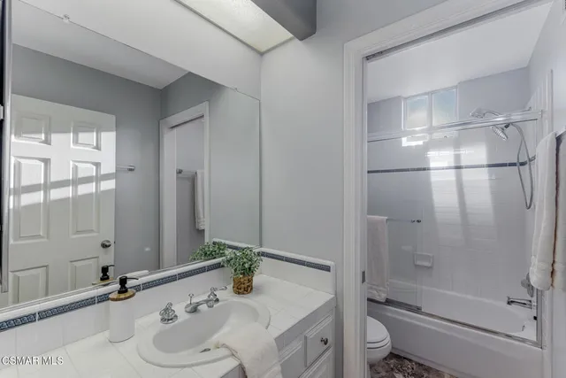 a view of a dining room with furniture and window