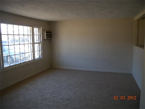 1 Howard Road Hudson, MA 01749 - Photo 2 of 7 an empty room with a window