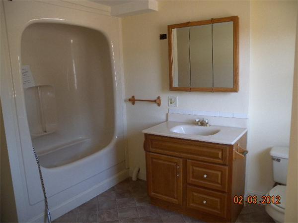 1 Howard Road Hudson, MA 01749 - Photo 4 of 7 a bathroom with a sink and a mirror