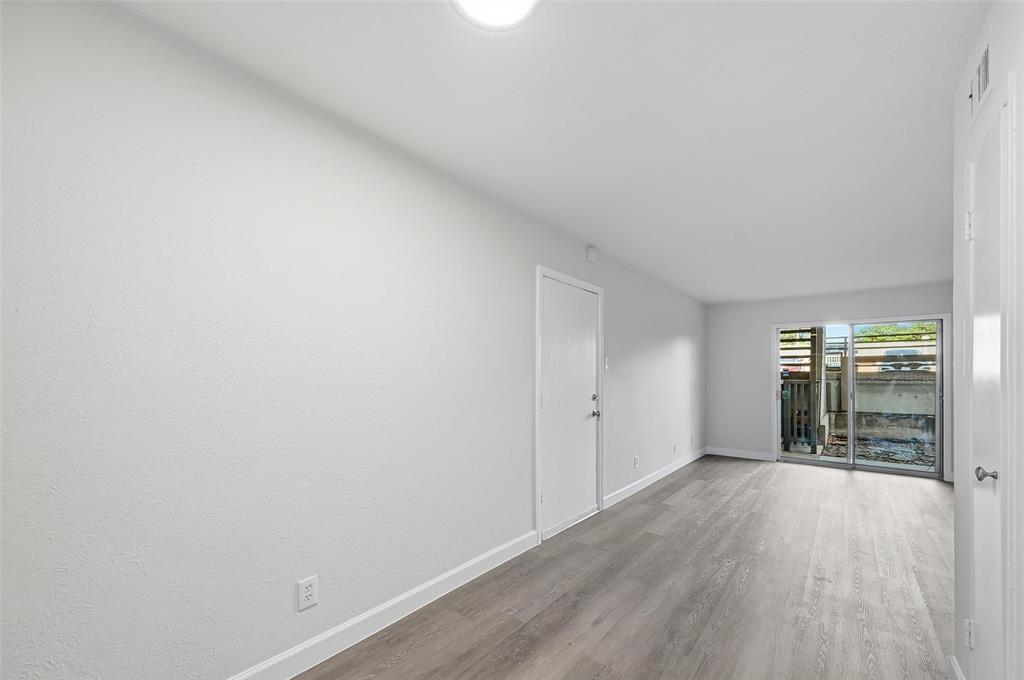 4859 Cedar Springs Road, Unit 136 Dallas, TX 75219 - Photo 16 of 28 a view of hallway with wooden floor