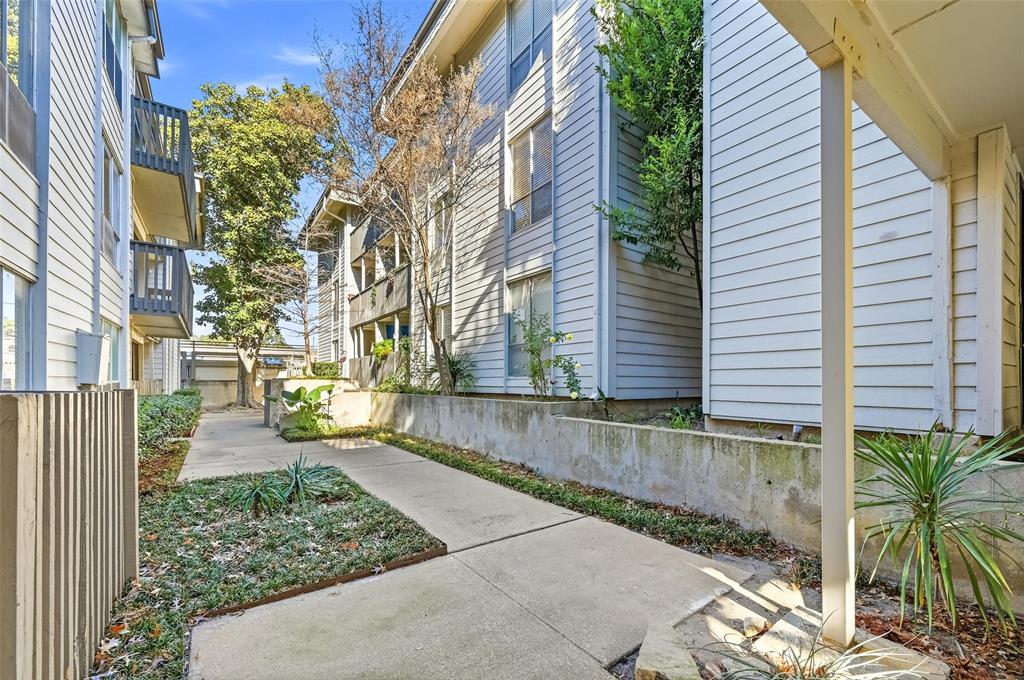 4859 Cedar Springs Road, Unit 136 Dallas, TX 75219 - Photo 2 of 28 a view of a pathway with a house