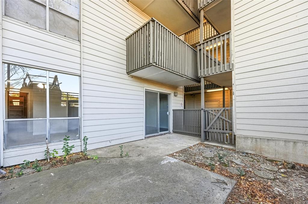4859 Cedar Springs Road, Unit 136 Dallas, TX 75219 - Photo 3 of 28 a view of a house with a garage