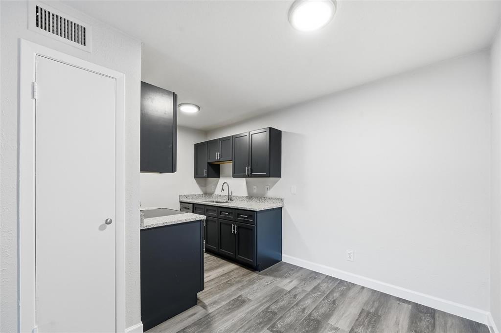 4859 Cedar Springs Road, Unit 136 Dallas, TX 75219 - Photo 6 of 28 a kitchen with a sink and cabinets