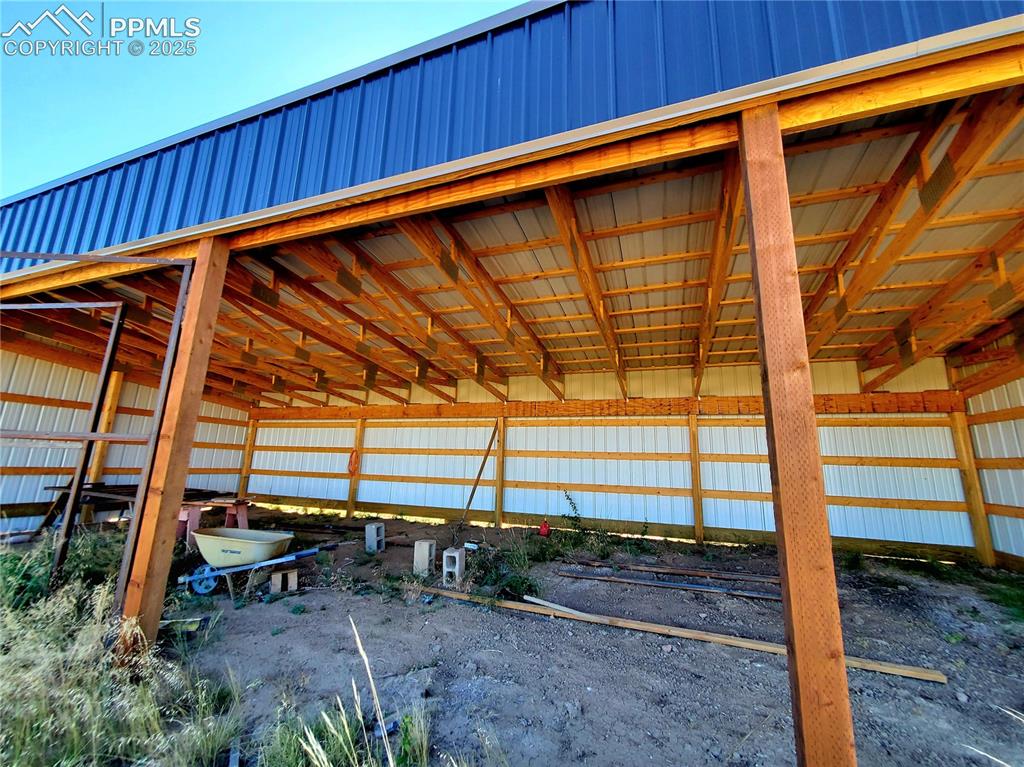 650 County Road Rye, CO 81069 - Photo 19 of 27 a backyard of a house with a bench and wooden floor