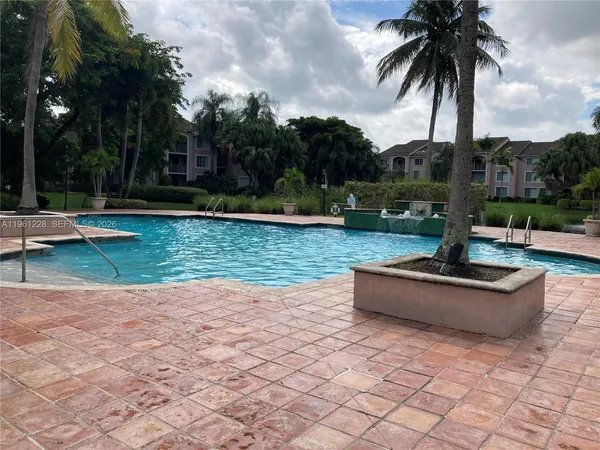 a view of a yard with palm trees