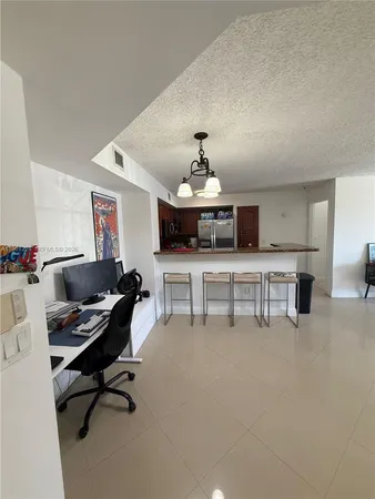 a view of an empty room with a floor to ceiling window