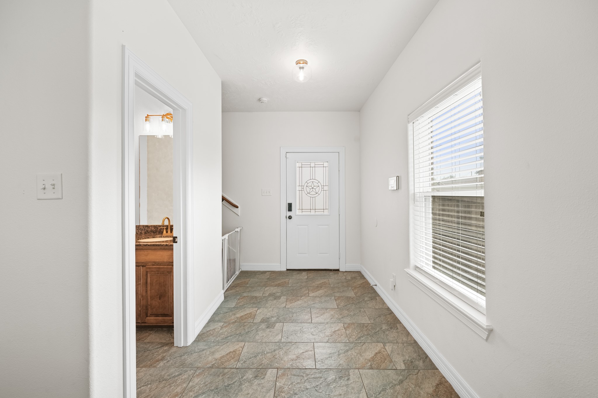 6101 Fox Ridge Drive Angleton, TX 77515 - Photo 8 of 30 a view of a hallway with bathroom and front door