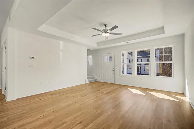 an aerial view of houses with a yard