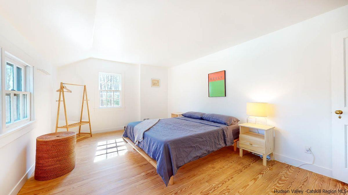 341 Bostock Road Shokan, NY 12481 - Photo 19 of 32 a bedroom with a bed and window