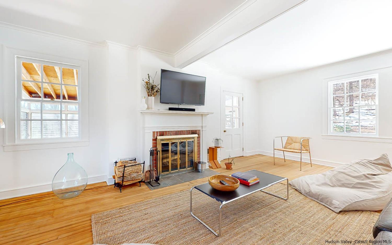341 Bostock Road Shokan, NY 12481 - Photo 3 of 32 a living room with furniture a fireplace and a flat screen tv