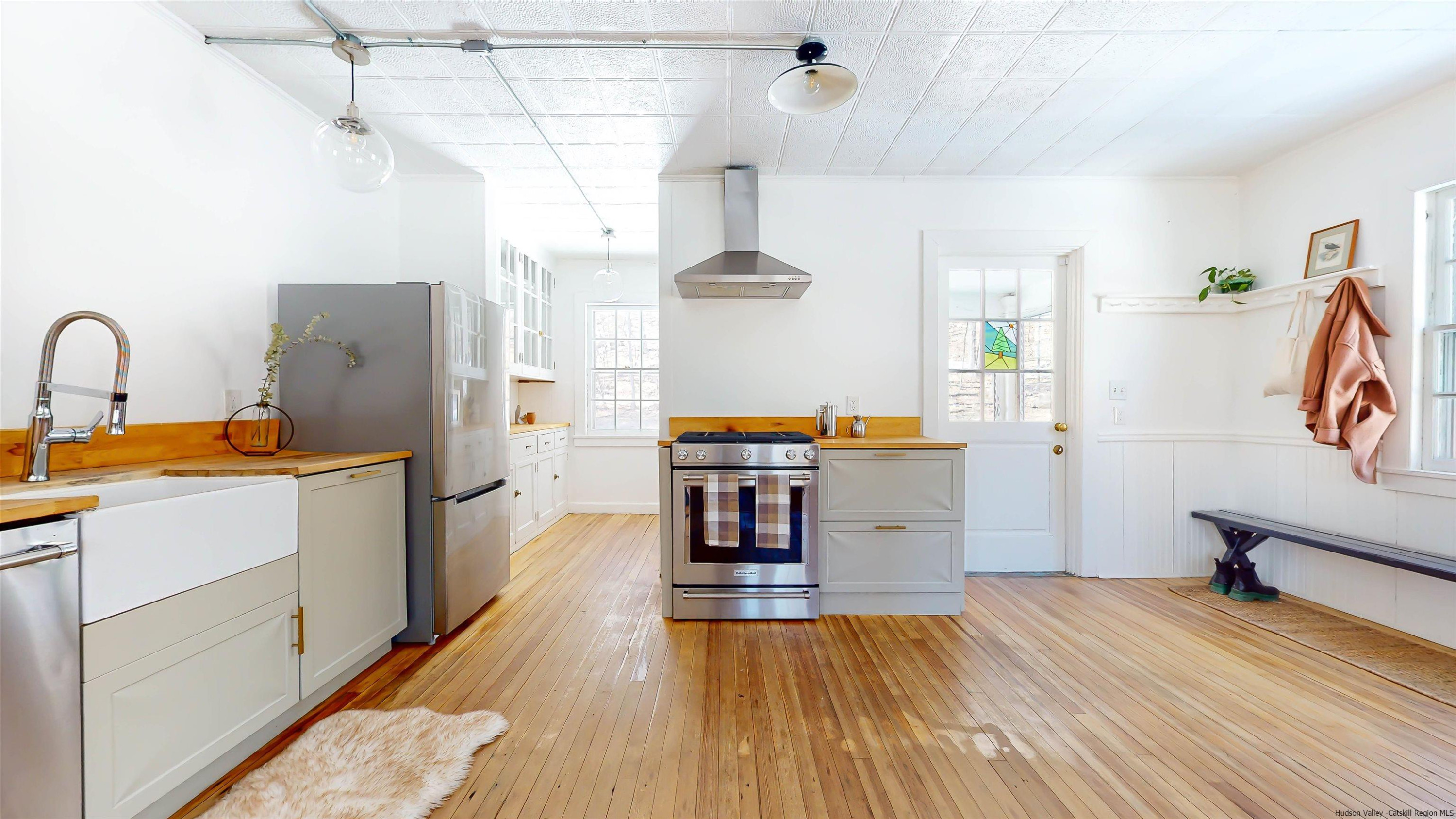 341 Bostock Road Shokan, NY 12481 - Photo 6 of 32 a kitchen with a refrigerator and a stove