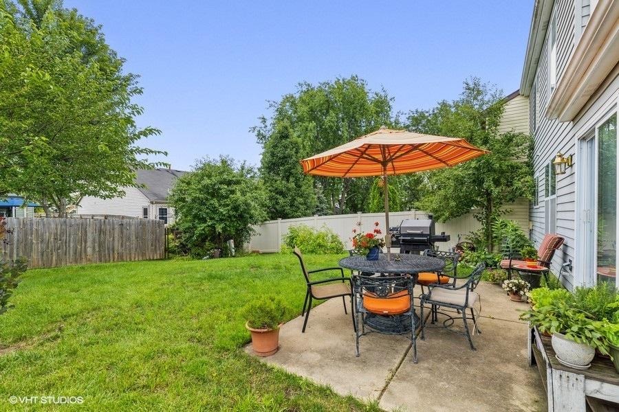 209 North Southport Road Mundelein, IL 60060 - Photo 4 of 18 a view of a backyard with sitting area and garden