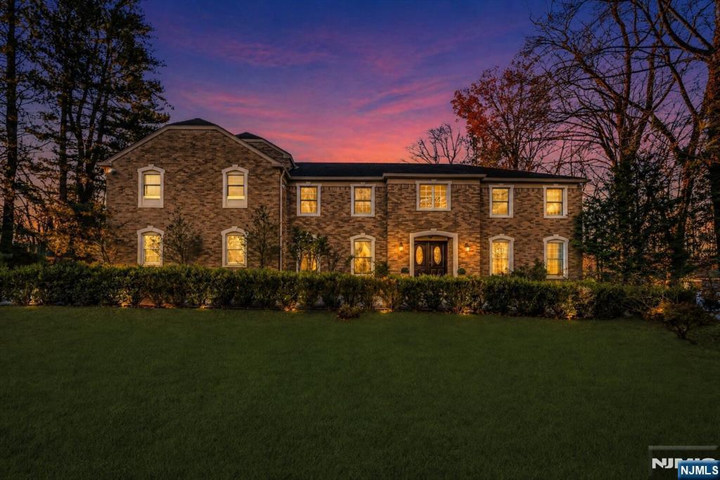 27 Pine Hill Road Old Tappan, NJ 07675 - Photo 1 of 50 a view of a white house with a big yard and potted plants