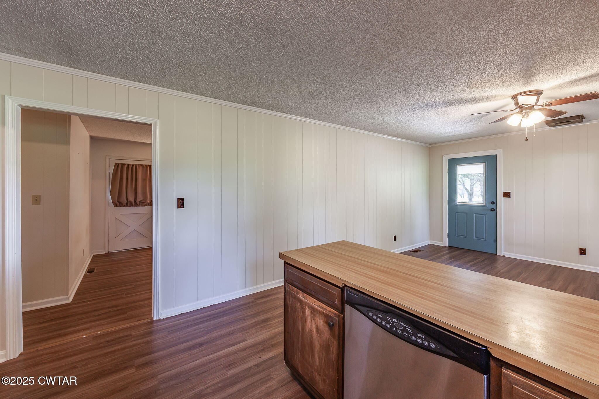 1140 Plainview Road Henderson, TN 38340 - Photo 13 of 29 a view of kitchen and empty room with wooden floor