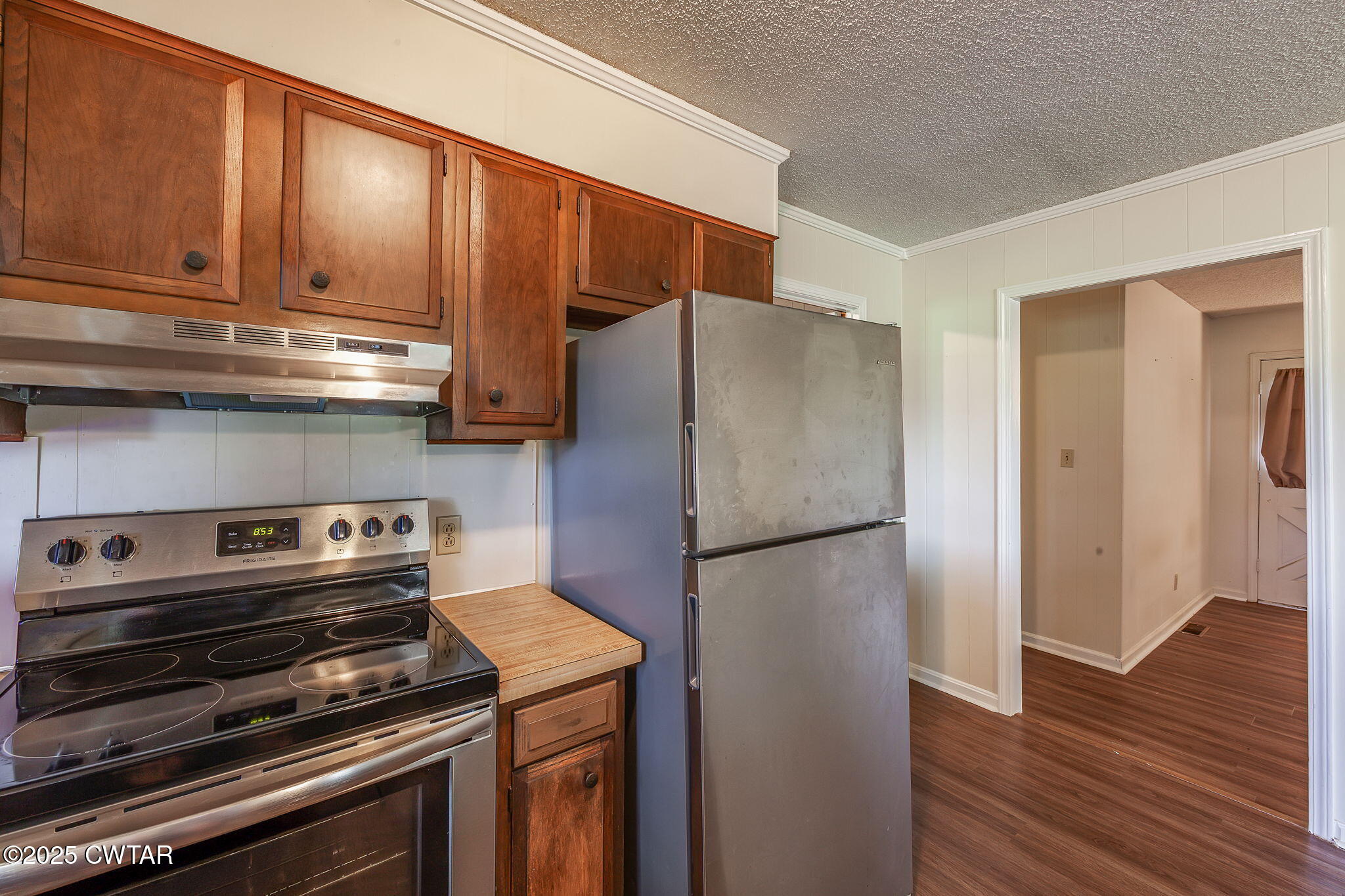 1140 Plainview Road Henderson, TN 38340 - Photo 14 of 29 a kitchen with a refrigerator and a stove top oven