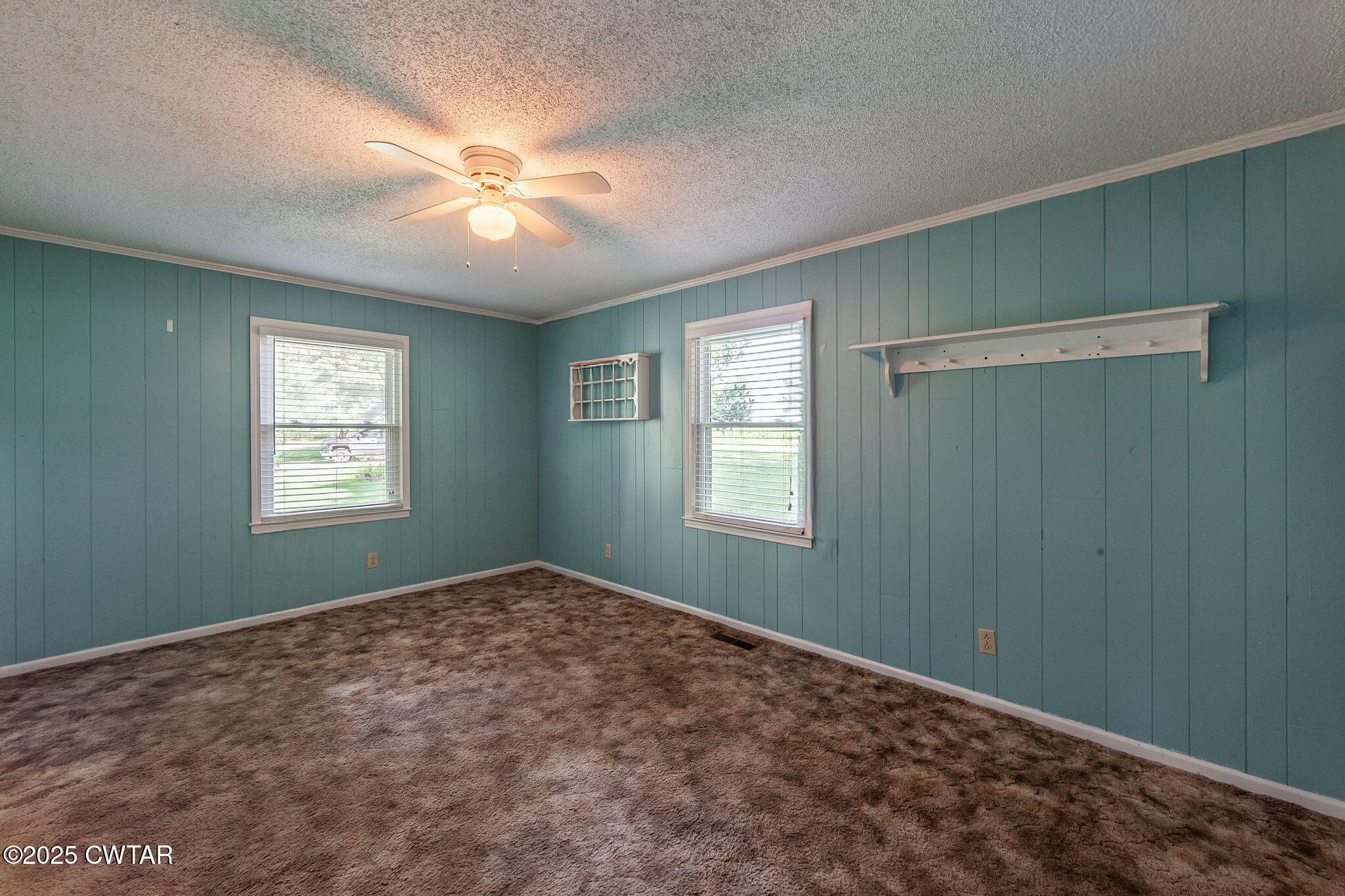 1140 Plainview Road Henderson, TN 38340 - Photo 24 of 29 a view of a big room with windows and chandelier fan