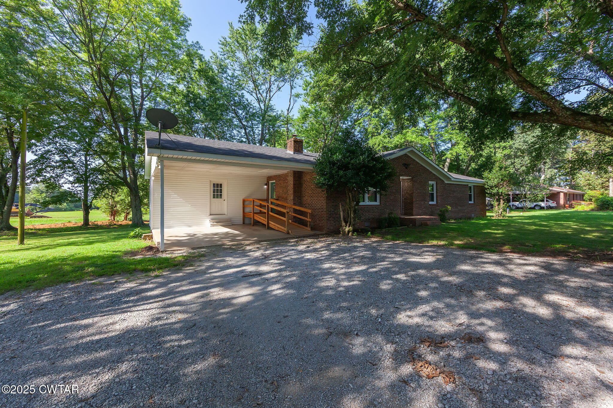 1140 Plainview Road Henderson, TN 38340 - Photo 3 of 29 a view of a house with yard and a garden