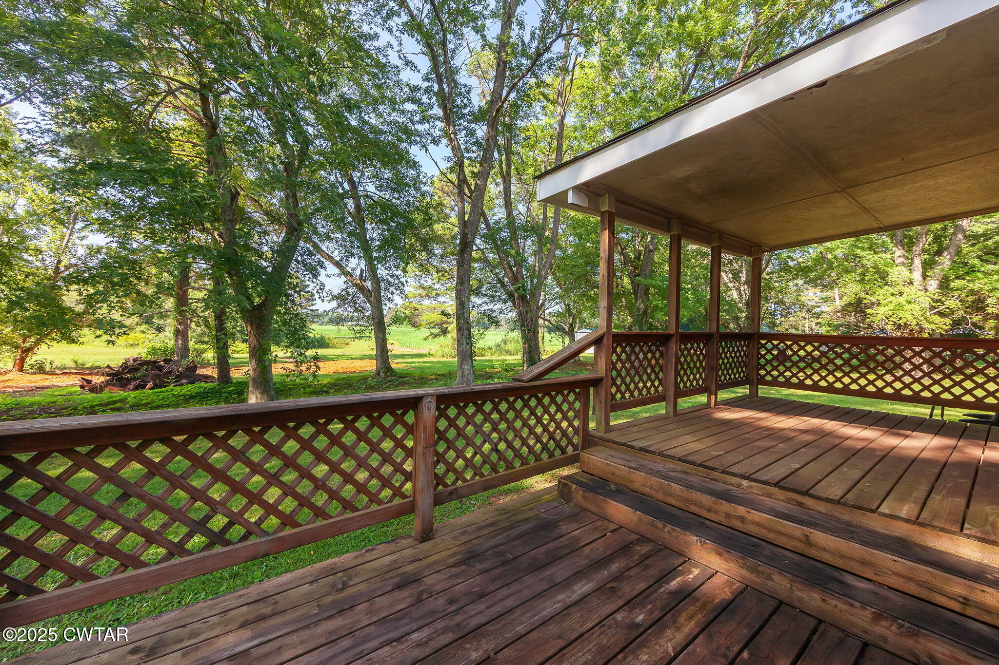 1140 Plainview Road Henderson, TN 38340 - Photo 5 of 29 a view of a wooden deck with a yard