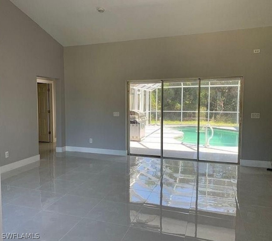 3353 Captains Cove Naples, FL 34112 - Photo 6 of 13 an empty room with sliding door