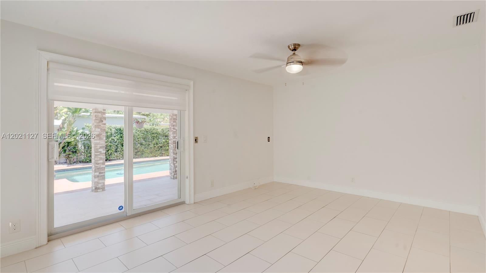 3611 Southwest 23rd Street Miami, FL 33145 - Photo 14 of 56 3613 family room in open floor plan from Dining room with access to terrace & pool
