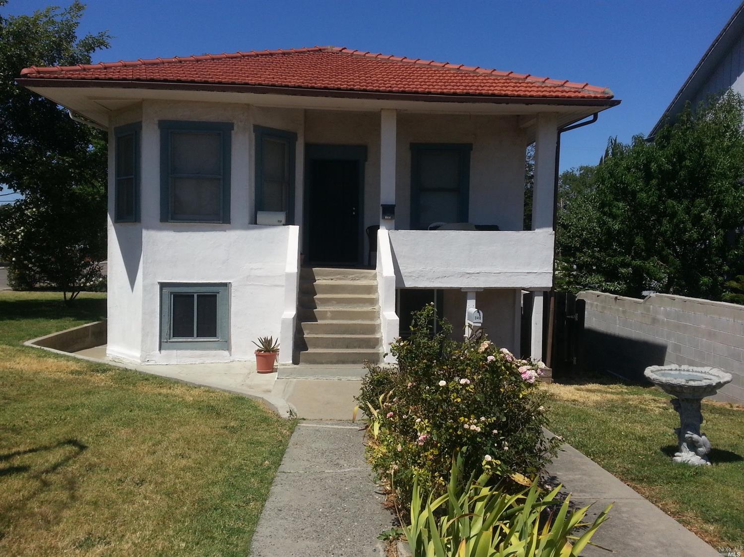 350 Riverview Street Rio Vista, CA 94571 - Photo 1 of 1 a front view of a house with garden