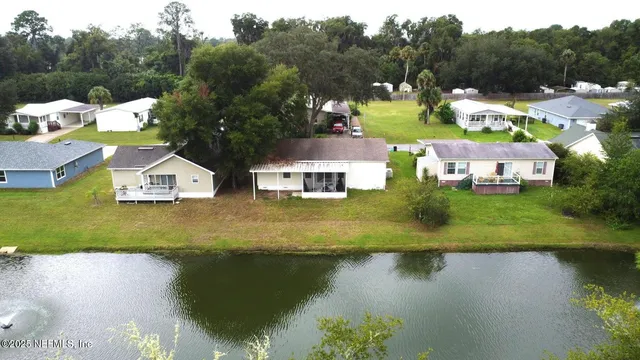 a view of a park with large trees