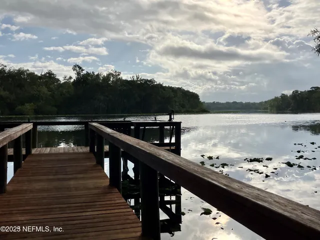 a view of a chairs and table in the yard