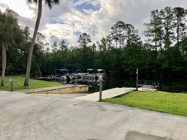 a view of a swimming pool with outdoor seating