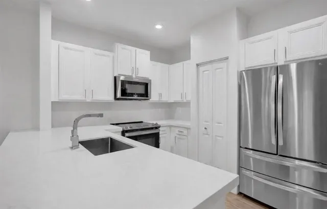 a bedroom with a bed and a couch