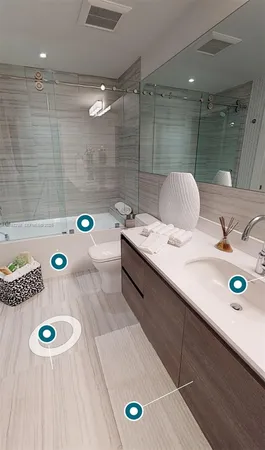 a bathroom with a granite countertop sink a mirror and shower