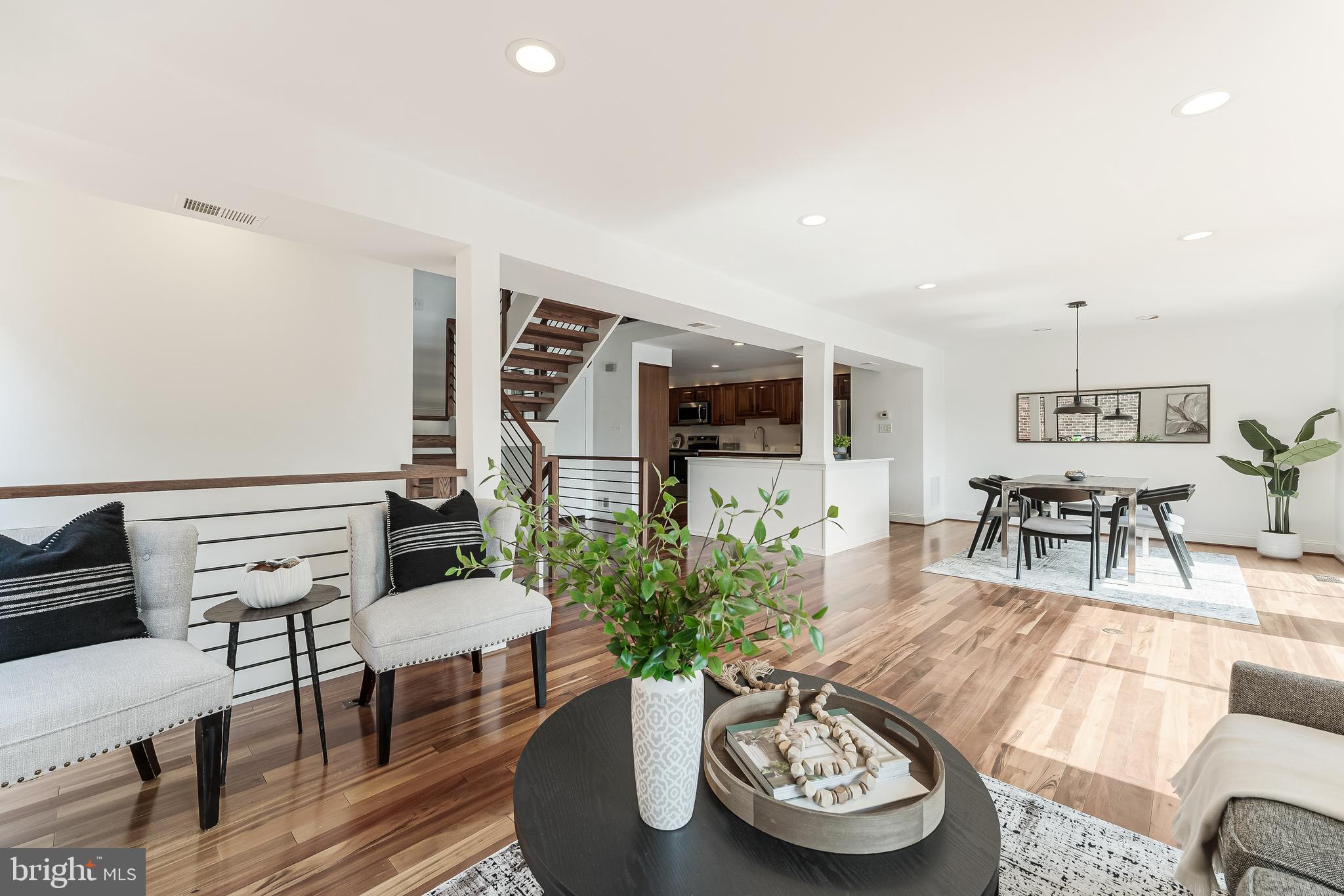 2127 Cabots Point Lane Reston, VA 20191 - Photo 24 of 66 a living room with furniture and a wooden floor