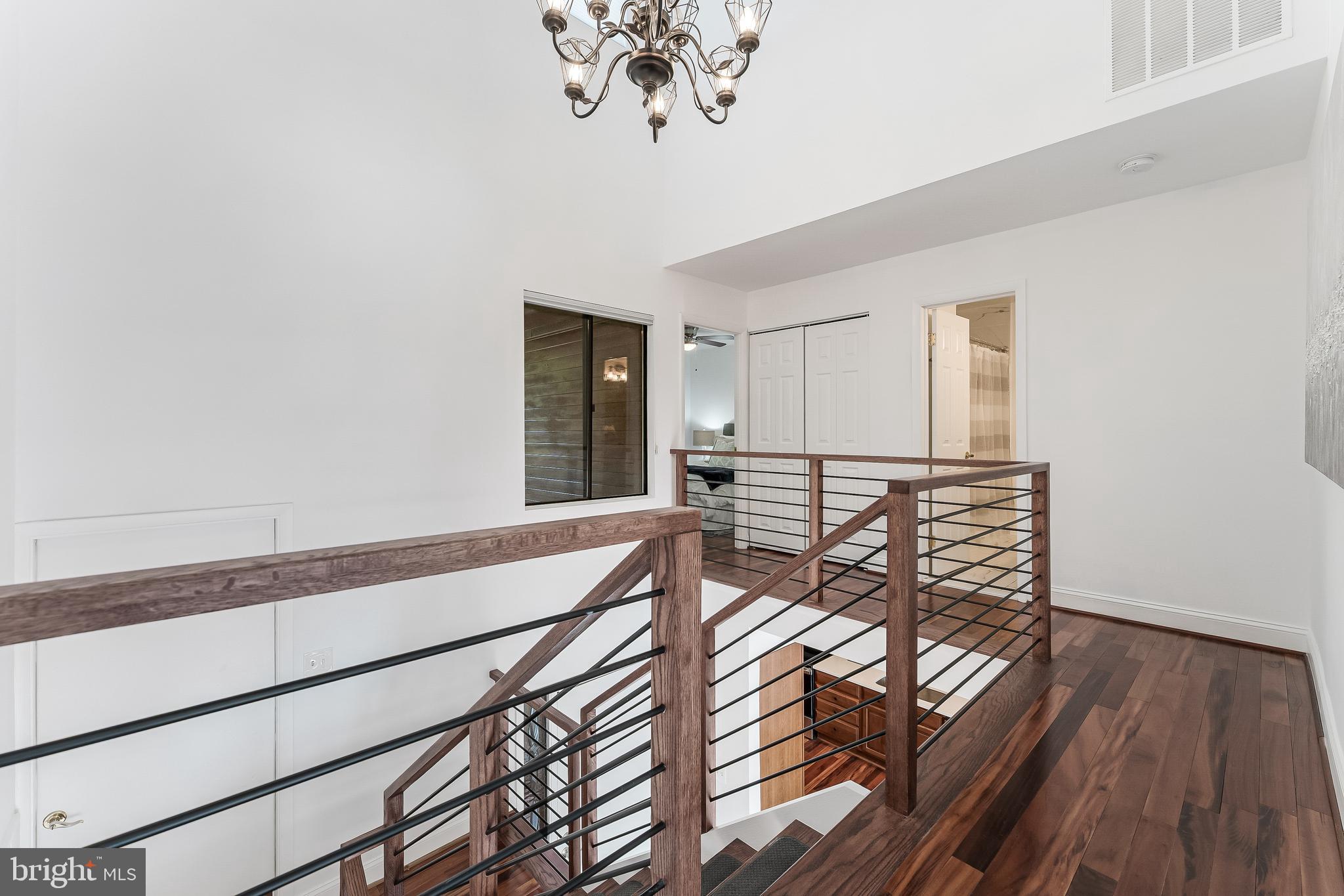 2127 Cabots Point Lane Reston, VA 20191 - Photo 33 of 66 a view of a hallway with wooden floor