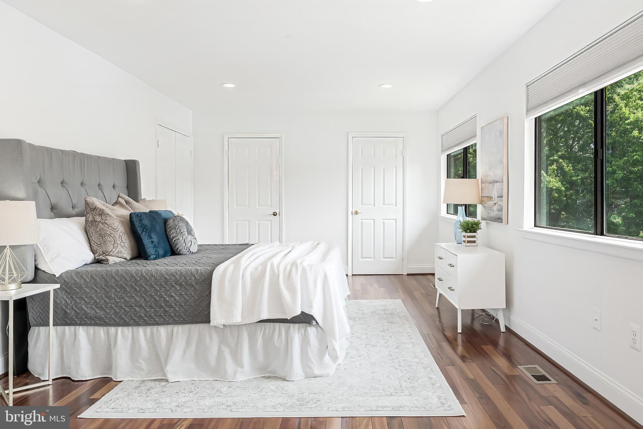 2127 Cabots Point Lane Reston, VA 20191 - Photo 41 of 66 a bed room with a bed and a large window
