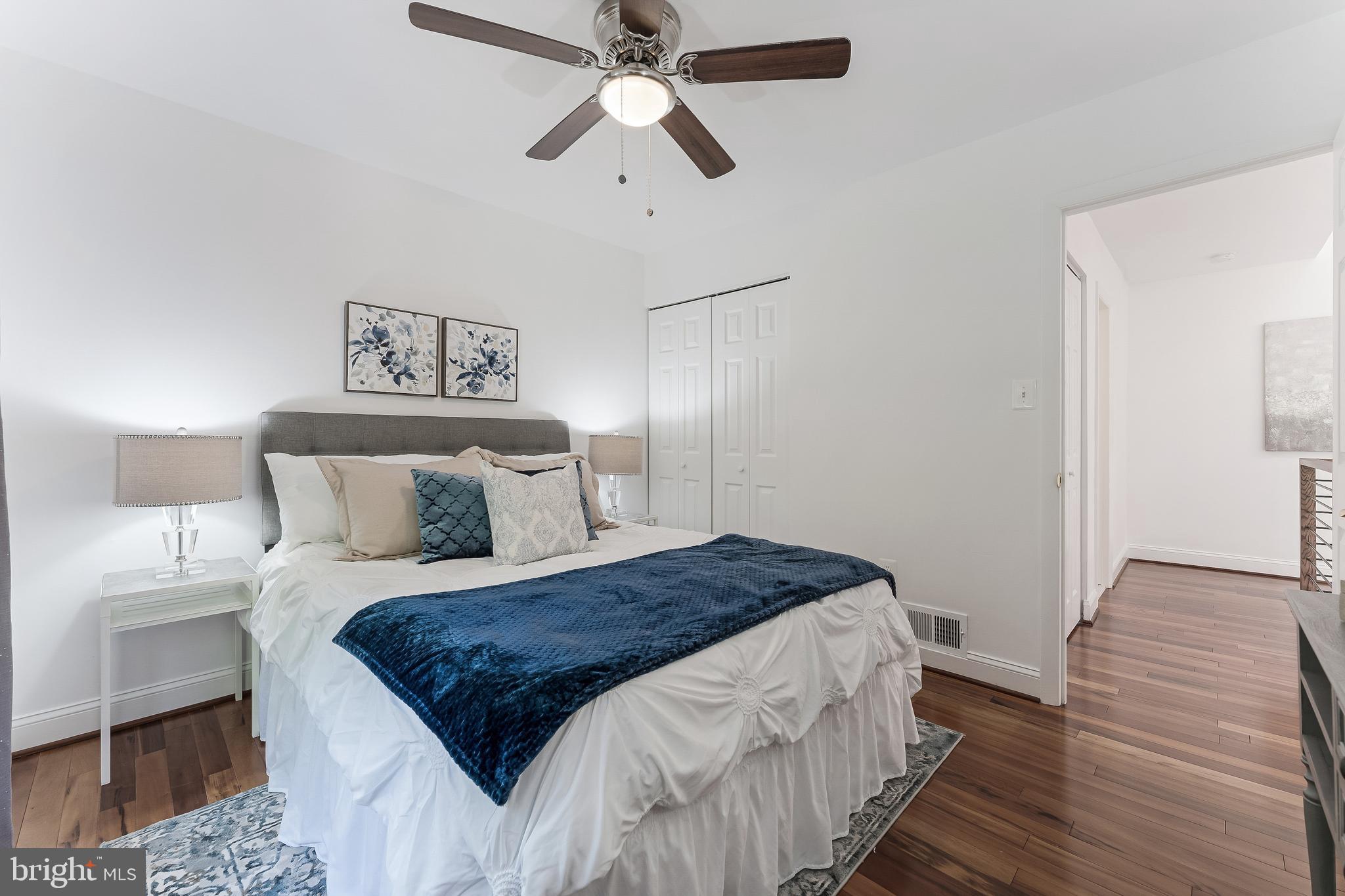 2127 Cabots Point Lane Reston, VA 20191 - Photo 47 of 66 a bedroom with a bed and wooden floor