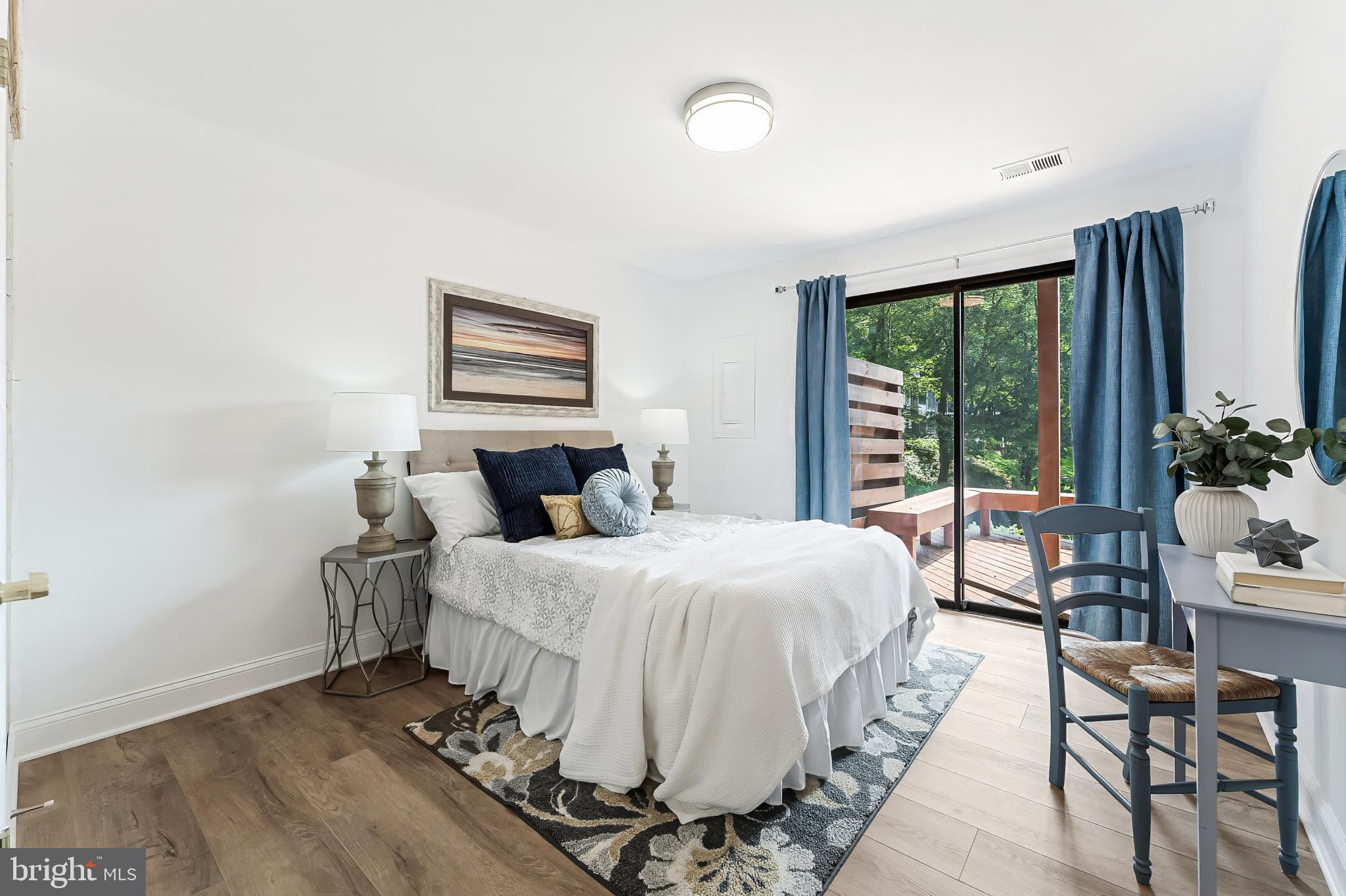 2127 Cabots Point Lane Reston, VA 20191 - Photo 58 of 66 a bedroom with a large bed and a window