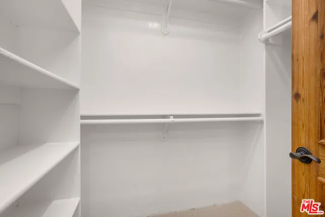 a living room with furniture and a lamp