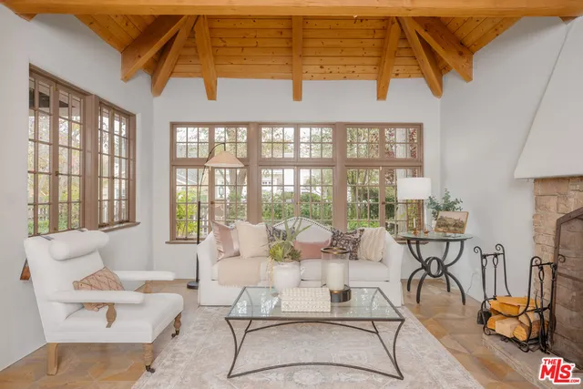a living room with furniture and a table
